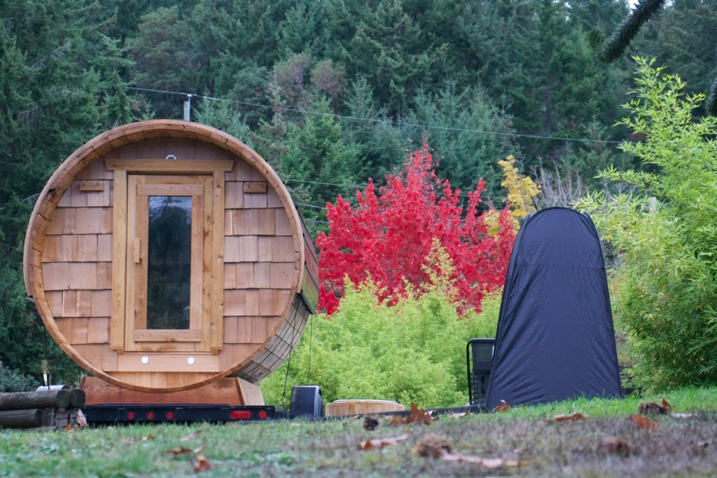 CURRENT’s cedar barrel sauna surrounded by trees and autumn colour